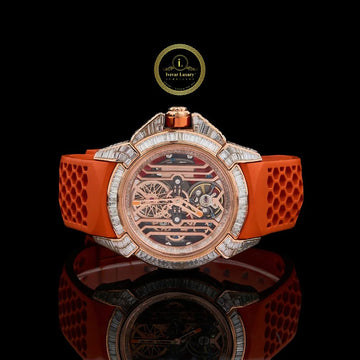 A Bold Rose Gold Watch with a Baguette Diamond Bezel, and Vibrant Orange Strap.