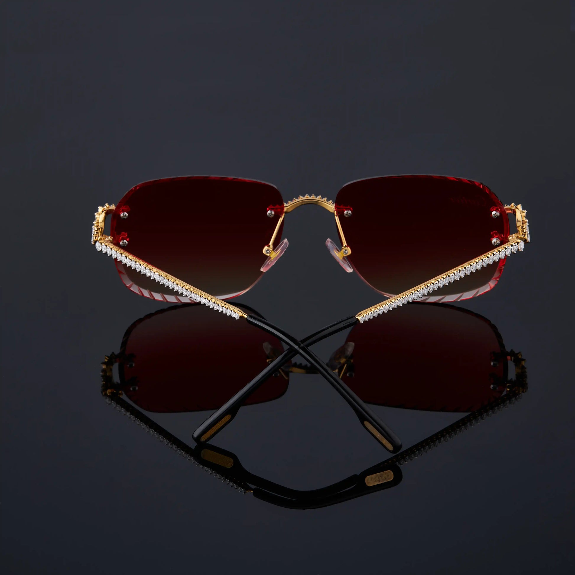 Sunglasses with red lenses and gold frame 