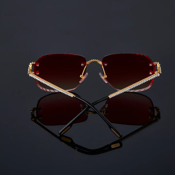Sunglasses with red lenses and gold frame 