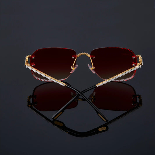 Sunglasses with red lenses and gold frame 