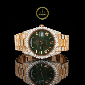 Luxury watch with green face and gold casing 