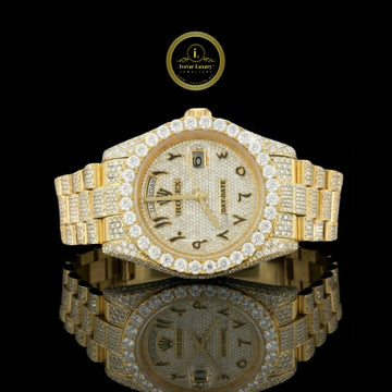 Gold Rolex watch with diamond accents 