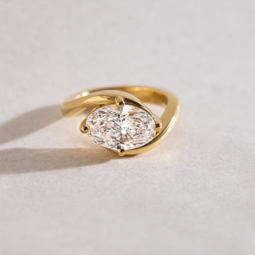 Oval Moissanite Diamond Solitaire Ring With Sculptural Bypass Band
