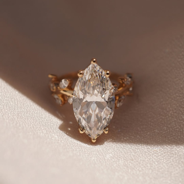 Nature Inspired Marquise Moissanite Diamond Ring With Leaf Accent
