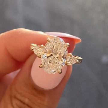 Oval Moissanite Diamond Three Stone Ring with Pear Side Diamonds